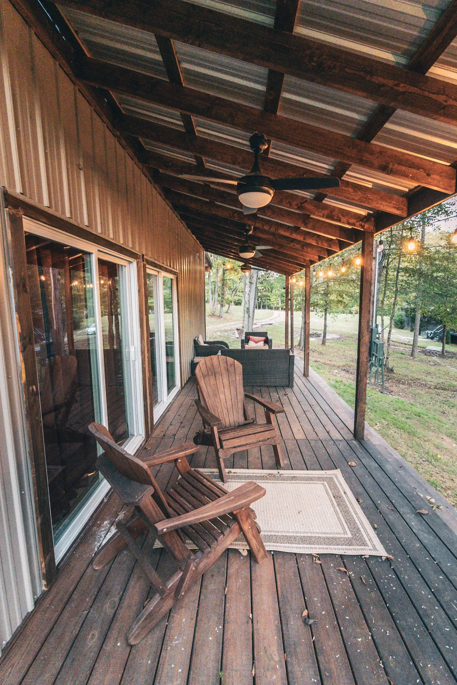 Covered porch with Adirondack chairs