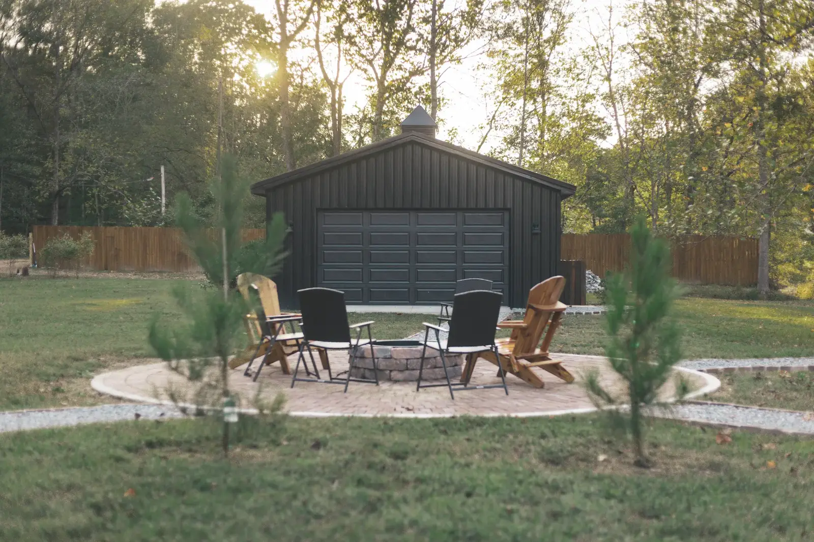 Fire pit gathering area near the shed