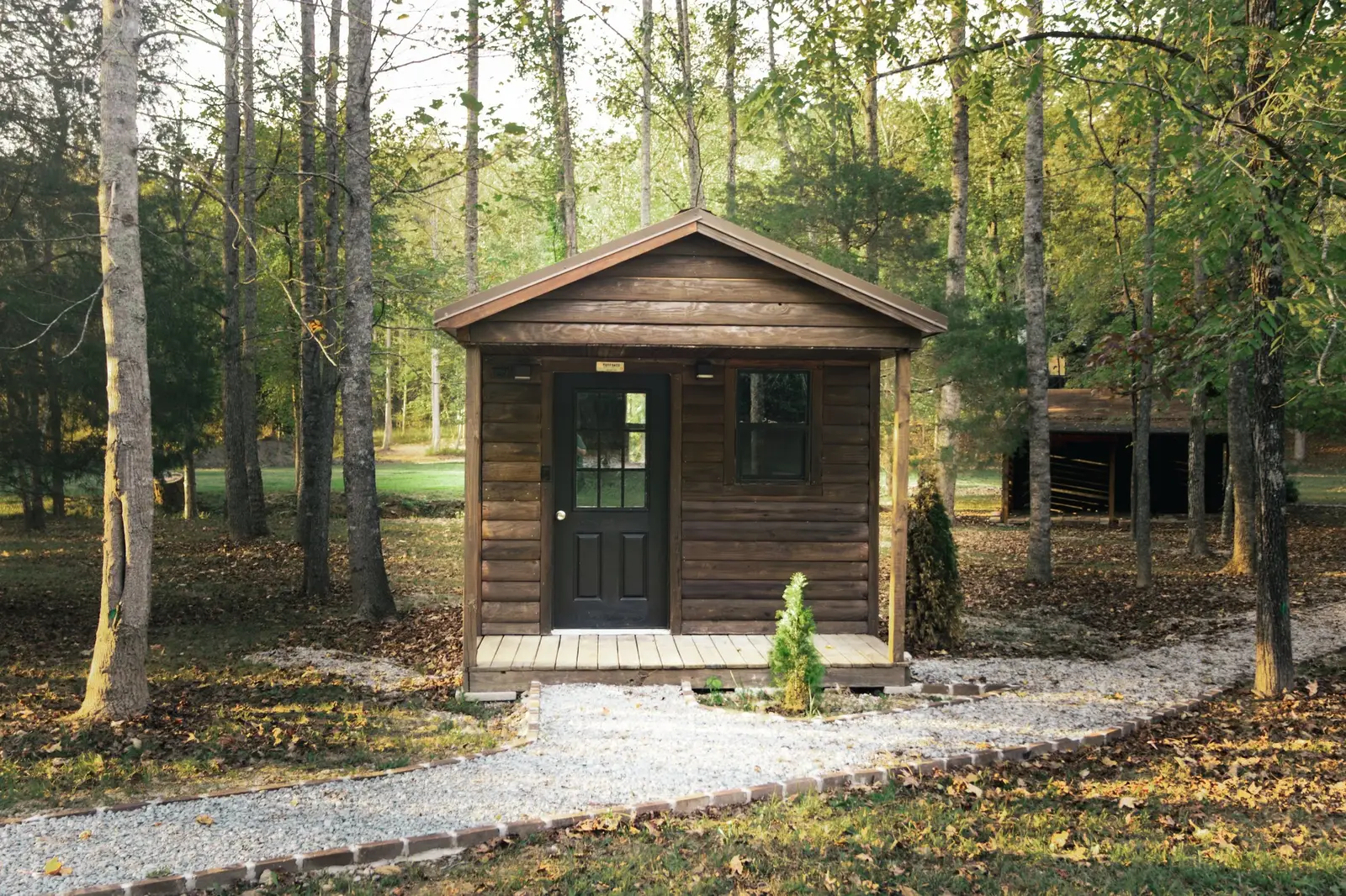 Log cabin exterior nestled in the trees