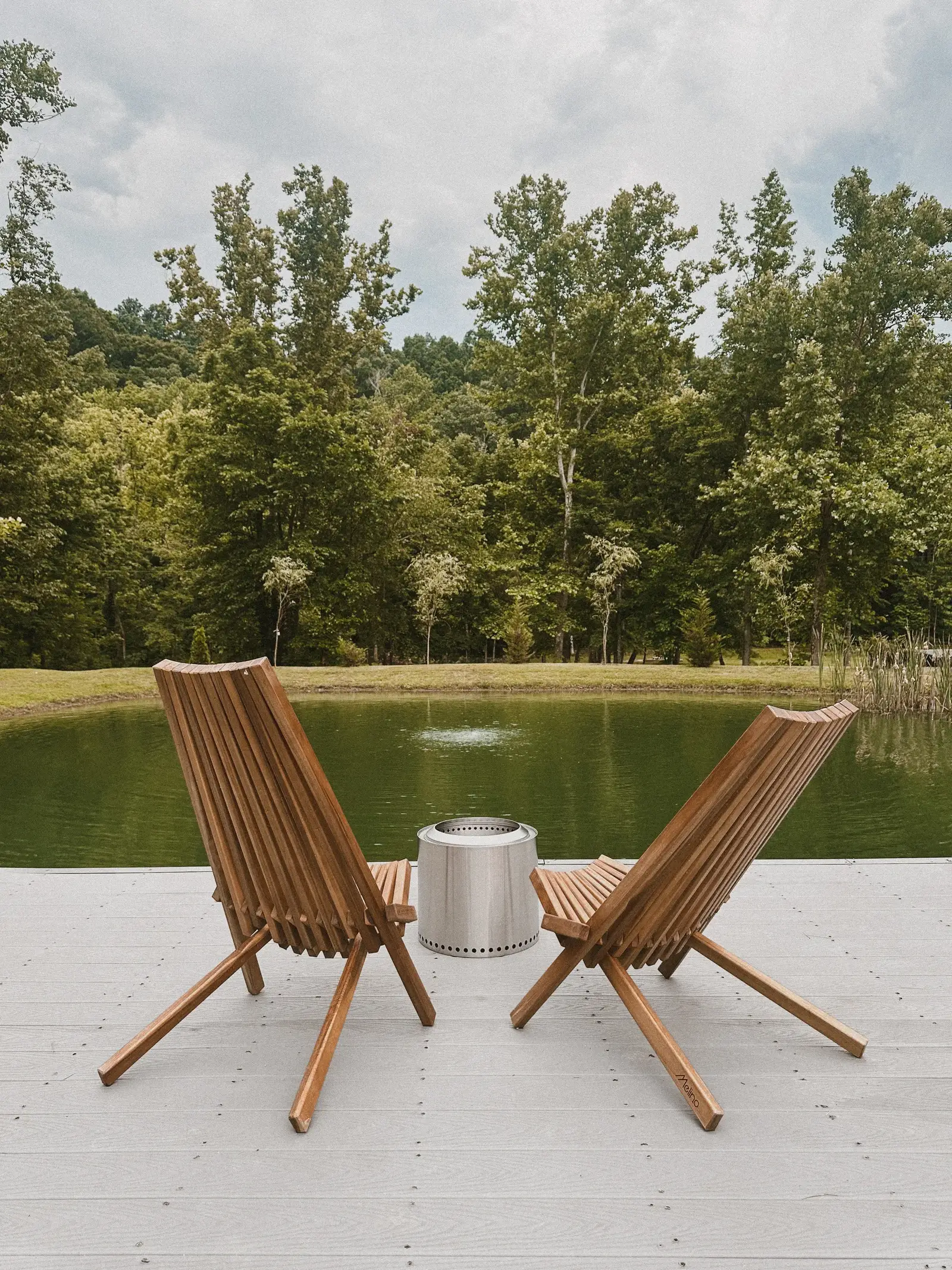 Pond deck with chairs and Solo Stove fire pit